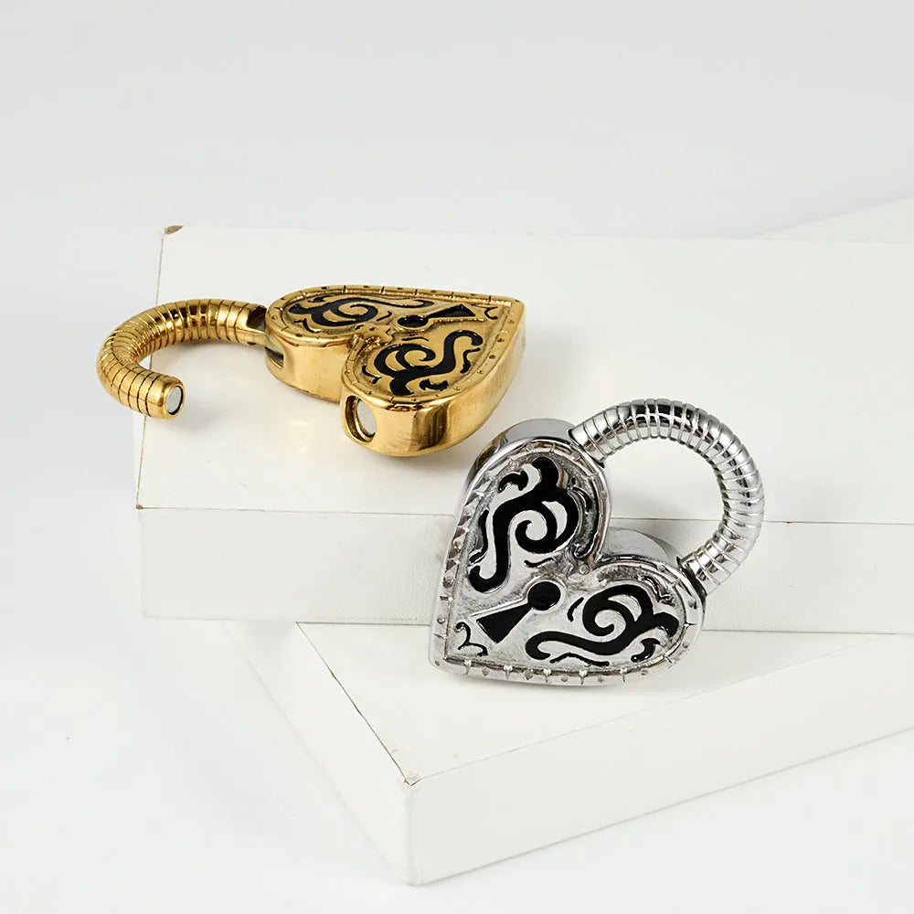 A single heart-shaped earring in stainless steel with a choice of gold or steel electroplated colour.