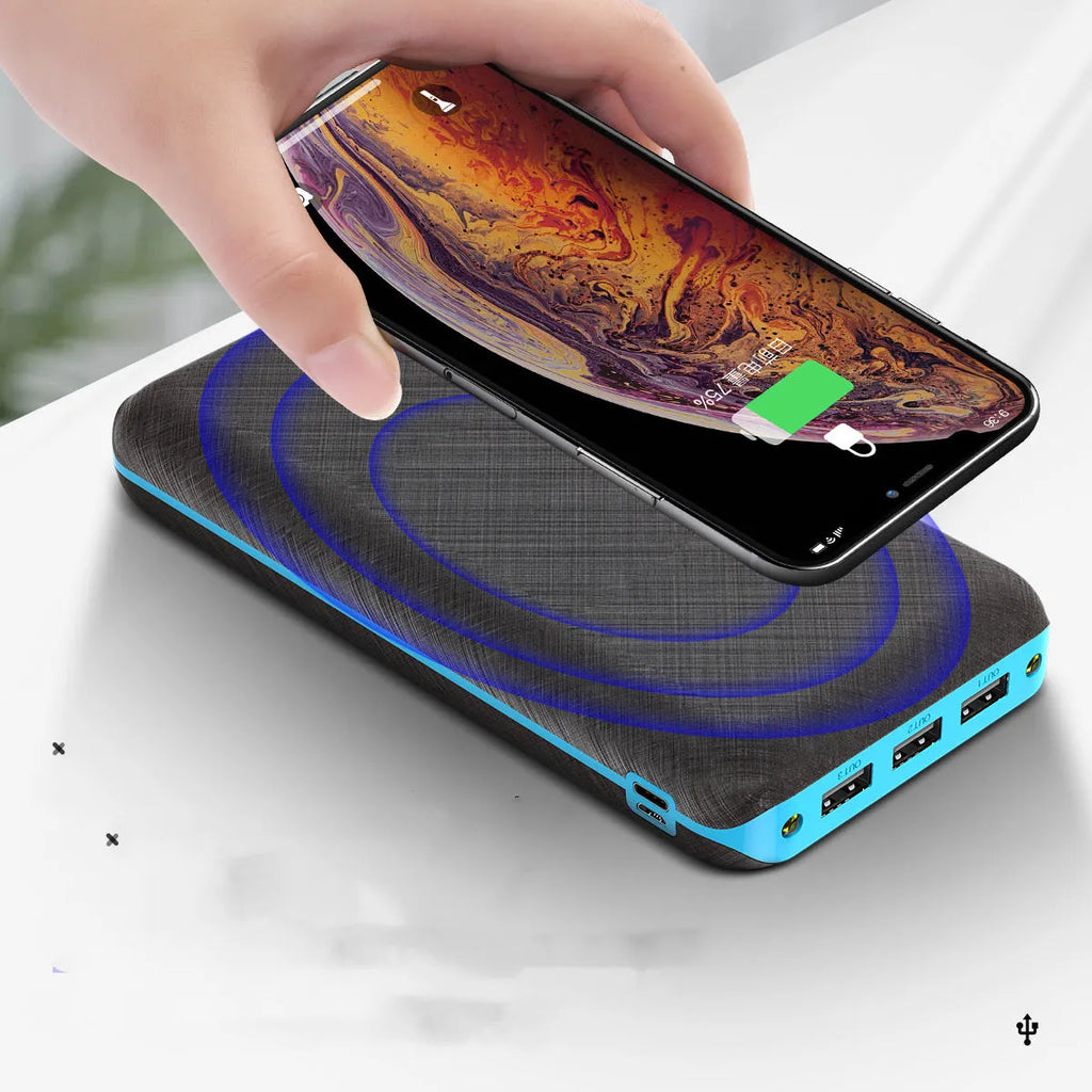 Portable power bank with wireless charging surface and USB ports in black colour