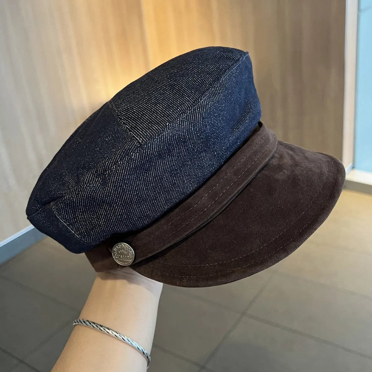 Dark blue denim newsboy hat with adjustable sizing and optional contrasting brim colours