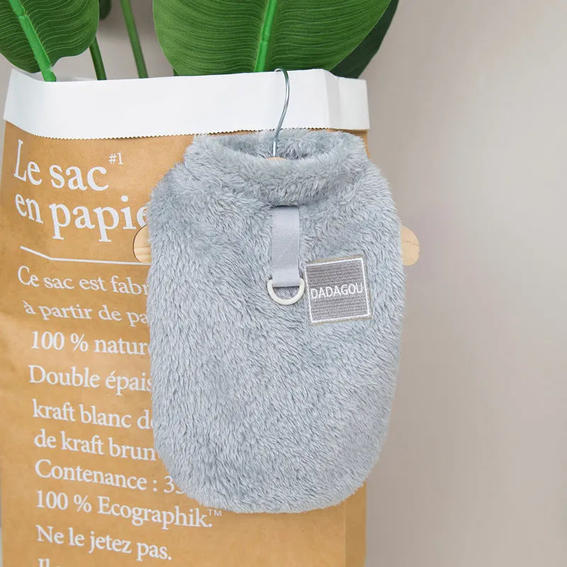 A blue coral fleece jacket for a dog, showing leg coverage and soft fabric texture.