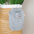 A blue coral fleece jacket for a dog, showing leg coverage and soft fabric texture.