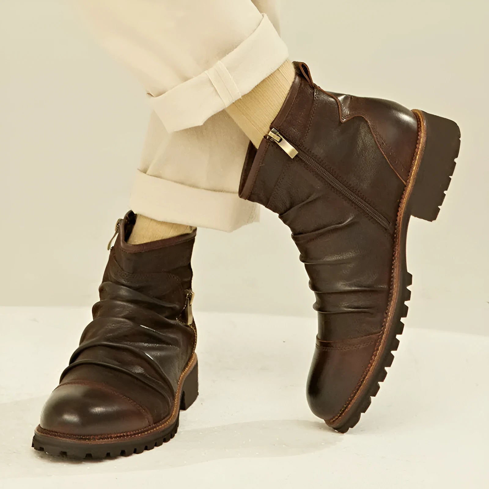 Black cowboy boots with side zip and embossed artificial PU leather upper, showing round toe and horseshoe heel