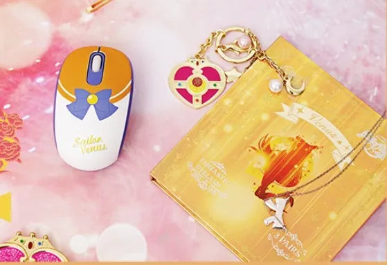 Pink Sailor Moon wireless mouse with USB receiver showing cartoon character design