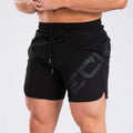 Men's black quick-dry running shorts with knee-length design for summer sports