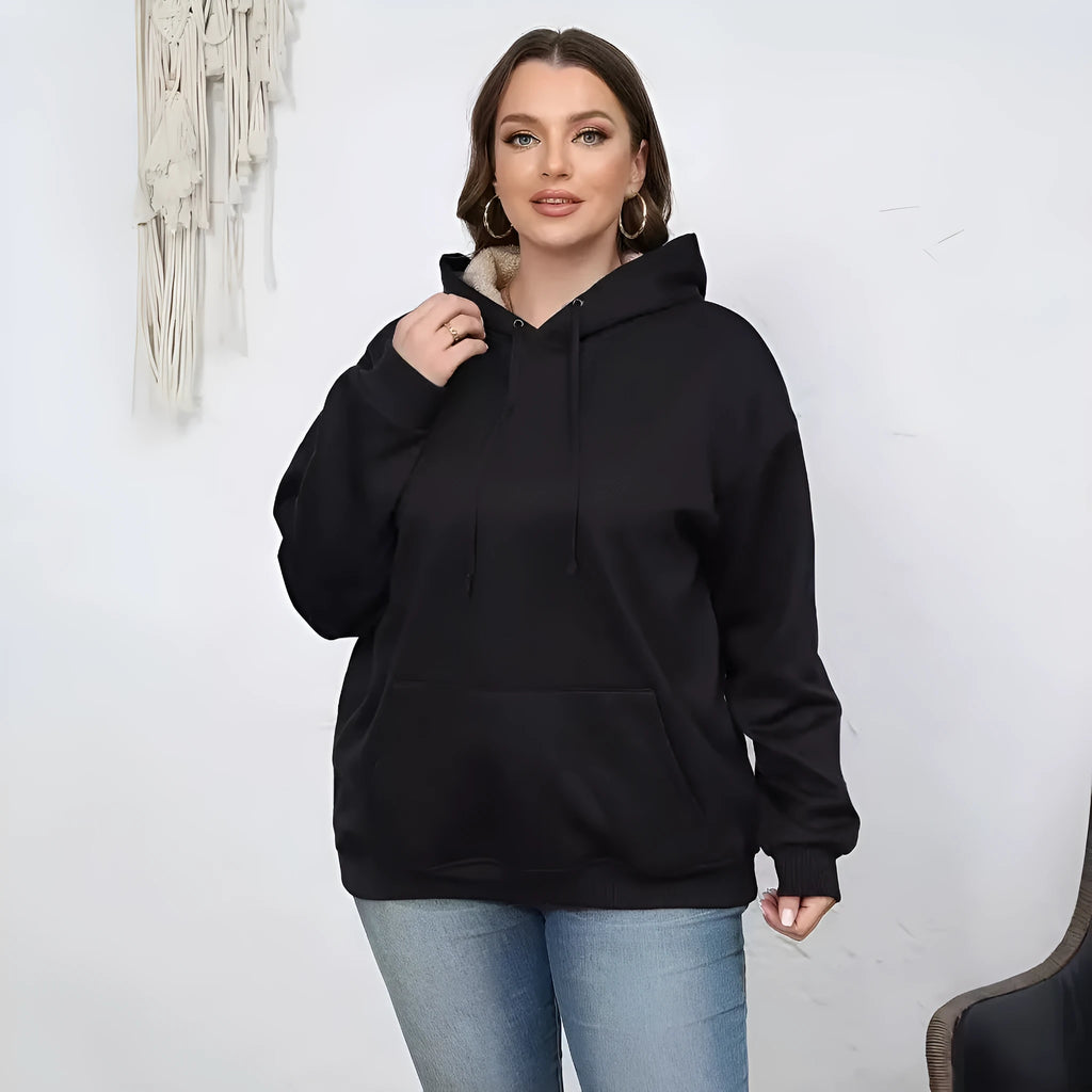 Women's loose black hooded sweater with pockets and a 3D textured pattern, long sleeves.