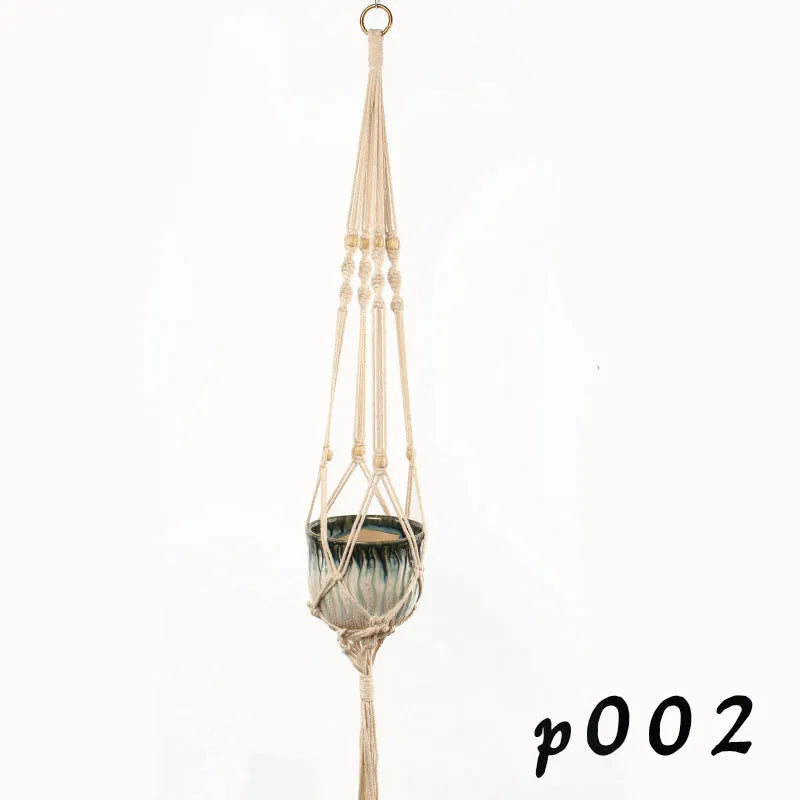 Woven wire cotton rope rustic hanging basket plant holder on a wall.