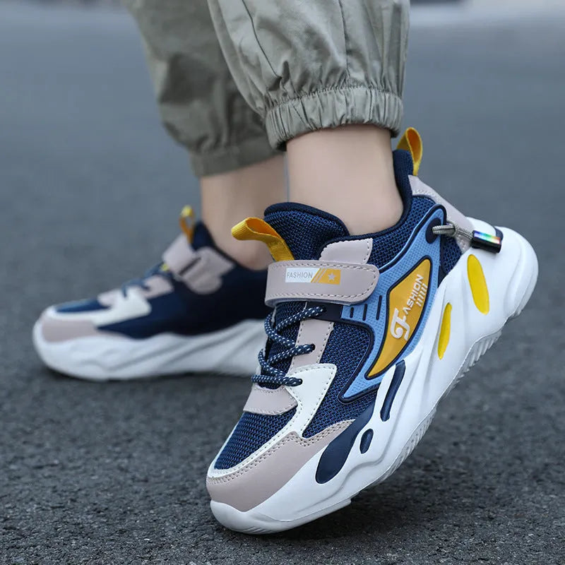Boys' dark blue and black platform sports shoes with Velcro strap and mesh upper.