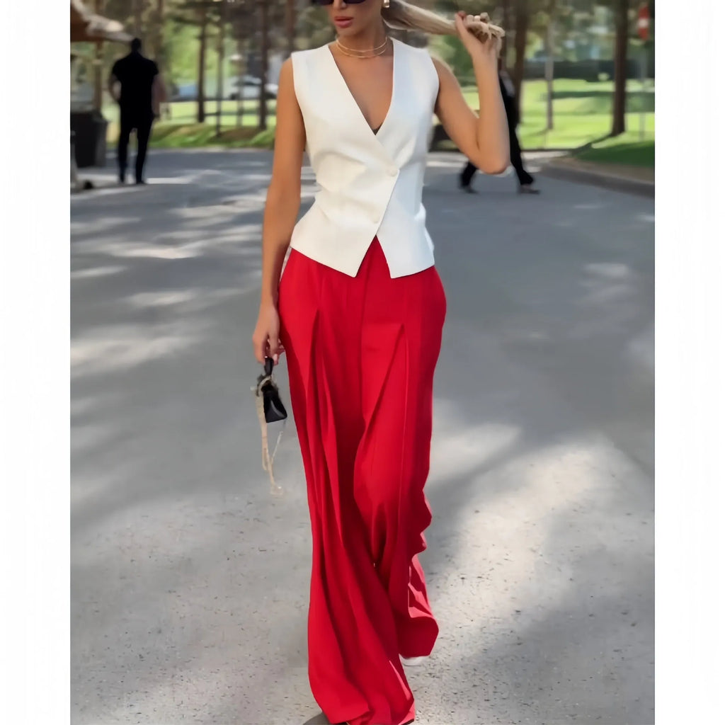 Women's beige two-piece set with deep V-neck sleeveless top and high-waist wide-leg trousers