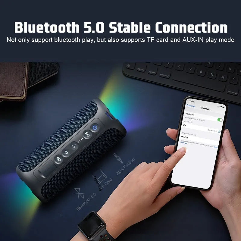 Black and blue fabric wireless Bluetooth speaker with LED lighting showing front controls