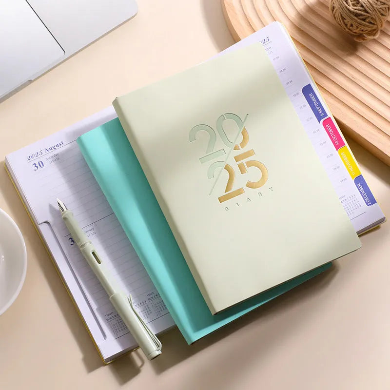 A5 daily planner with soft faux leather cover showing thread binding and open pages