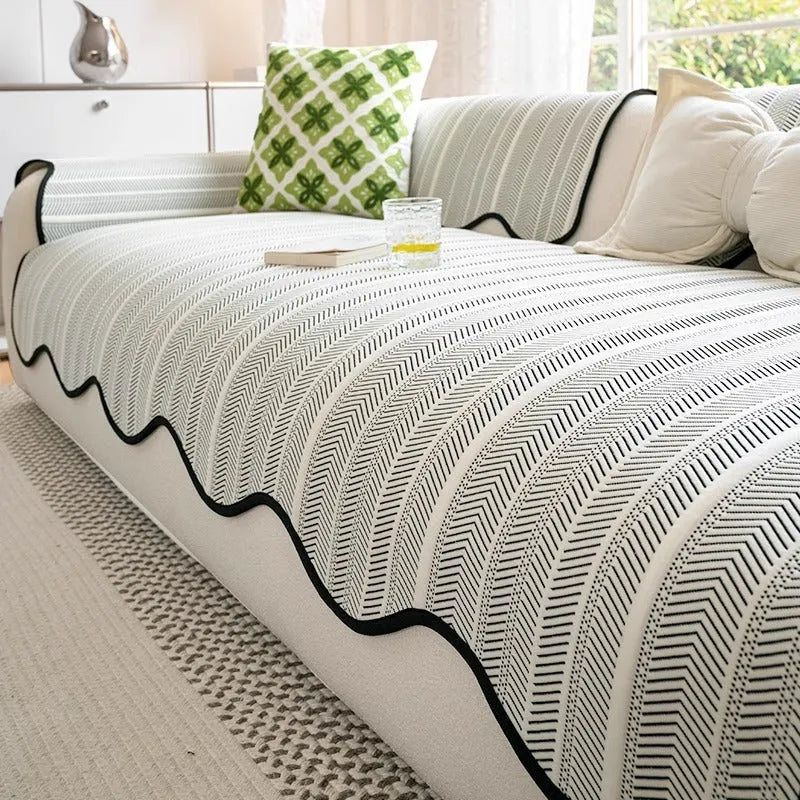 Special-shaped straight row mat cover in Ice Silk fabric on a sofa, showing non-slip design and light luxury style.