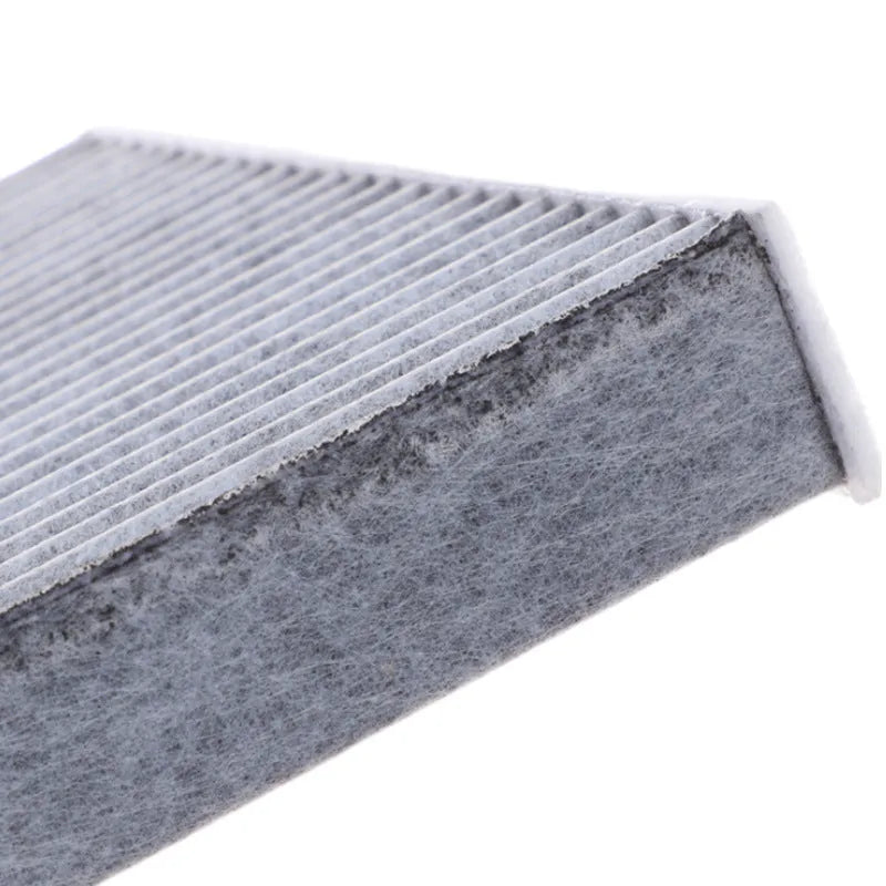Grey Geely vehicle cabin air filter grid panel measuring 215x210x30mm