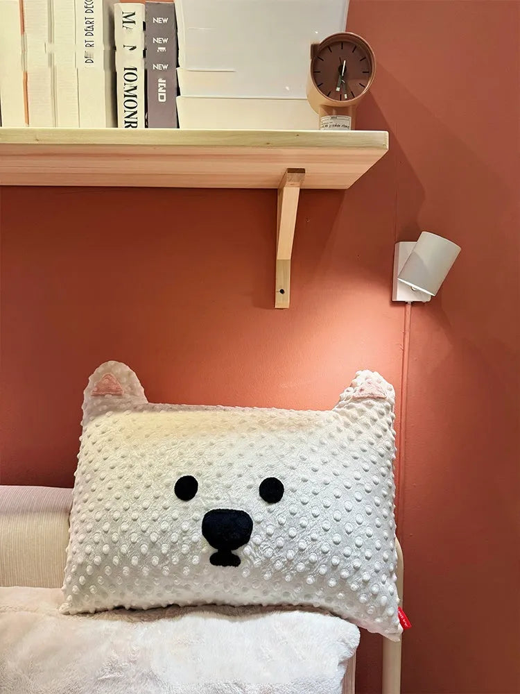 West Highland Terrier shaped decorative cushion pillow on a sofa.