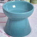 Black chin design ceramic pet bowl with high foot anti-tumble construction