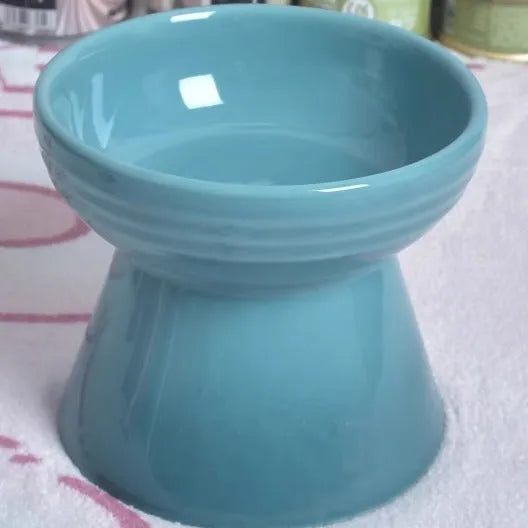 Black chin design ceramic pet bowl with high foot anti-tumble construction