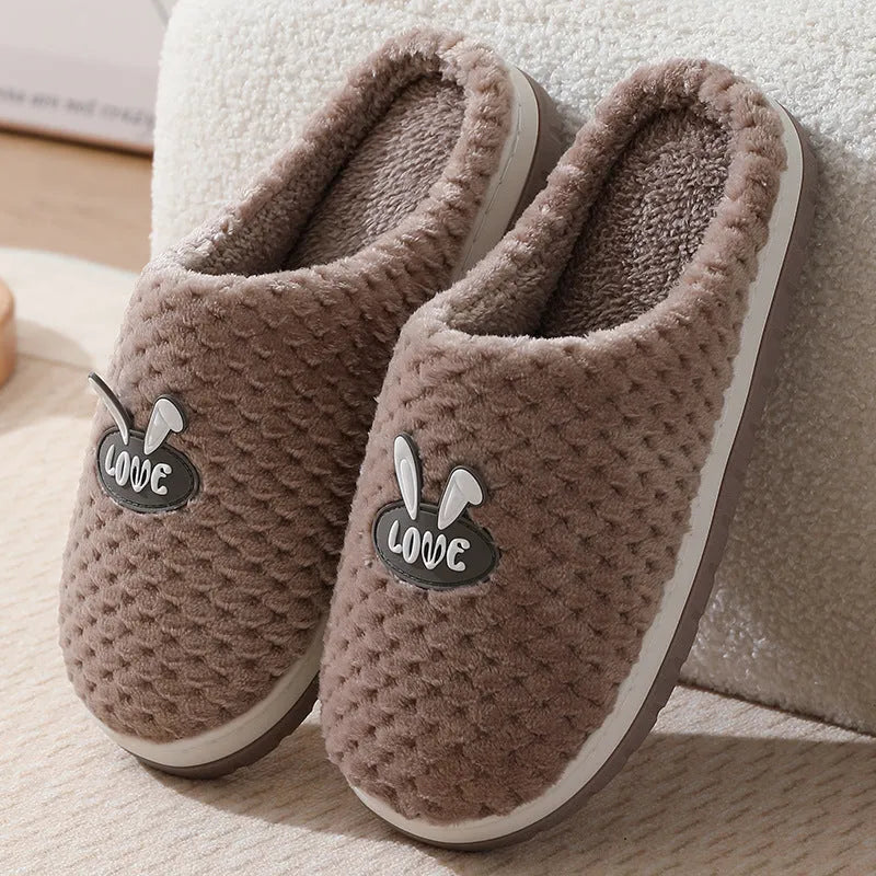 Women's plush rabbit plaid house slippers with thick rubber non-slip soles in apricot colour.
