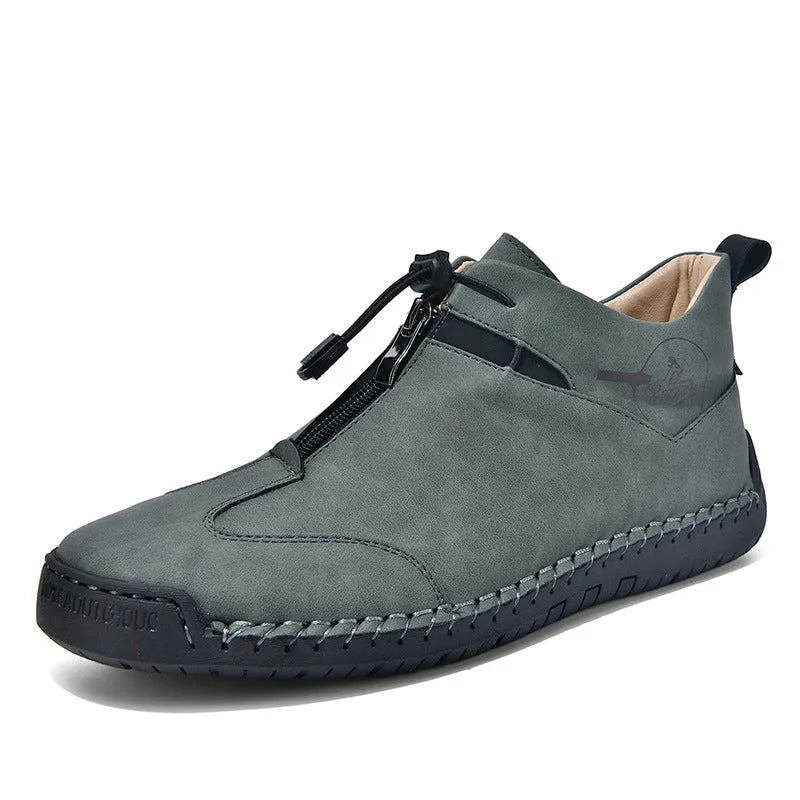 Men's black casual leather shoe with mid heel, rounded toe, and sewing thread detail on a white background.