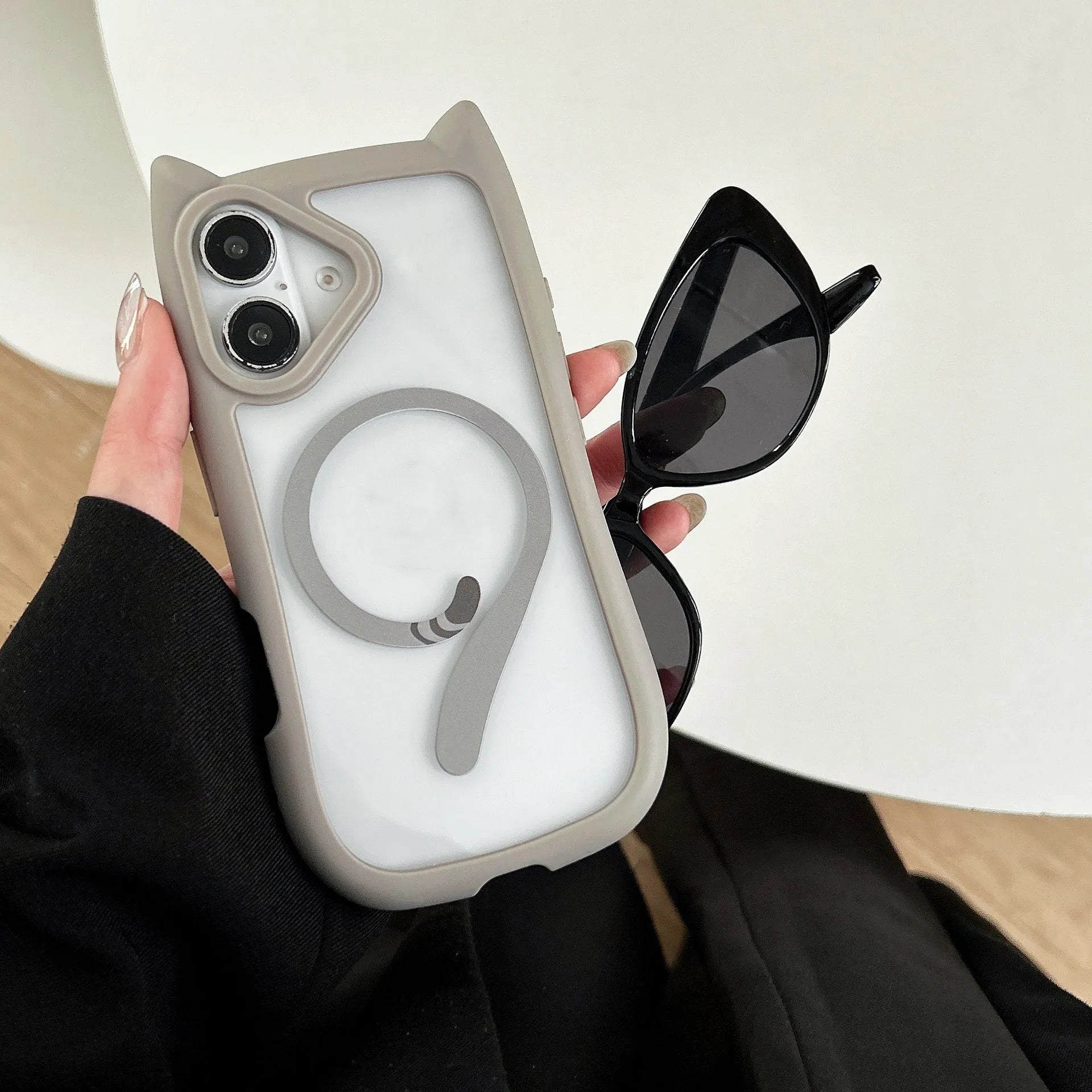 Transparent acrylic TPU phone case for iPhone 17 series in black colour, showing magnetic ring feature.
