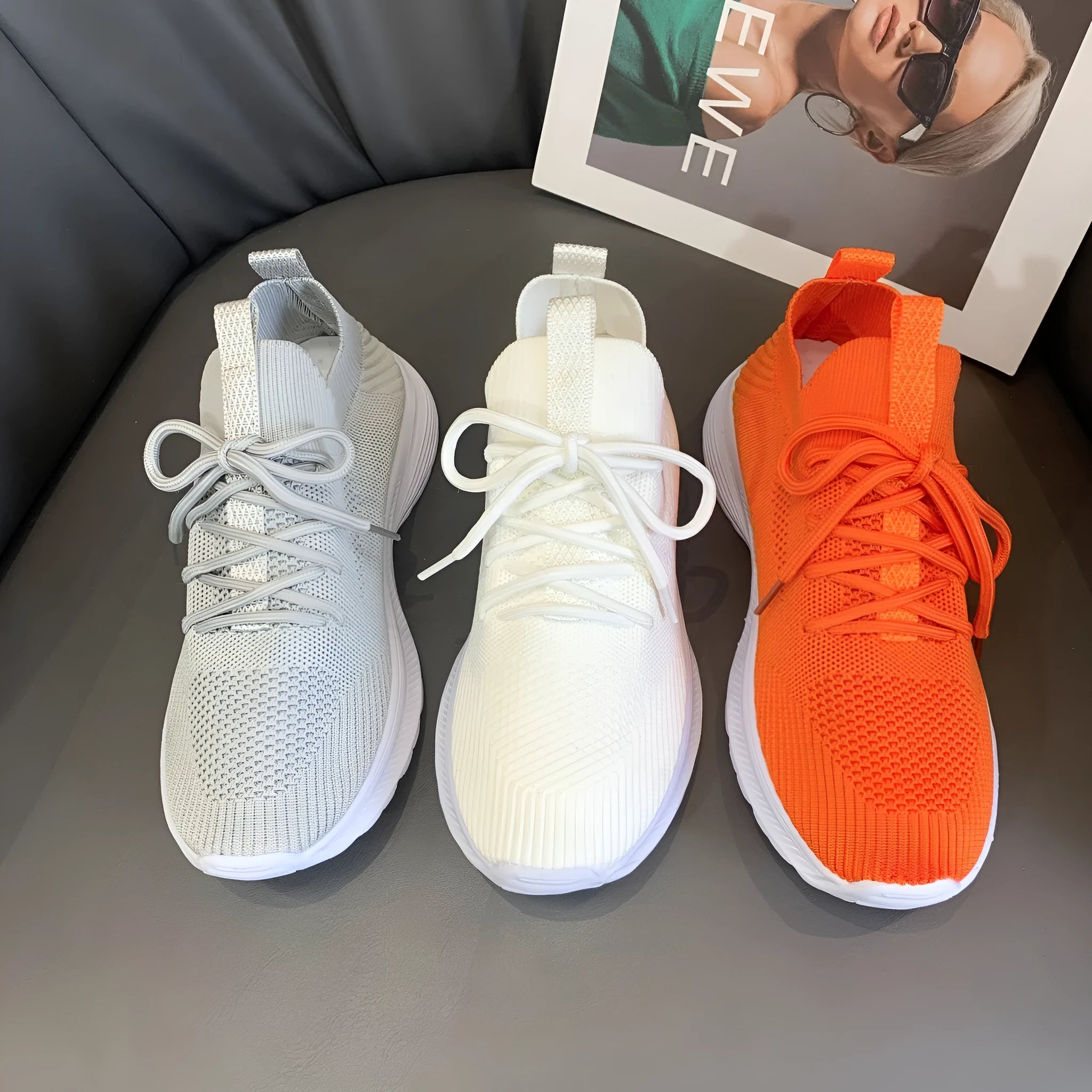 Women's mesh running shoes in creamy white with Flyknit upper and round toe design