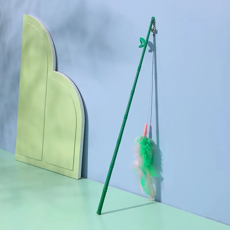 Green interactive cat wand toy with feather and bell refills for feline play