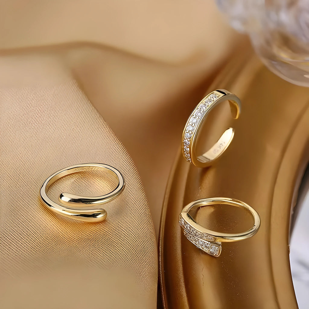 Geometric gold plated toe ring with rhinestone or water drop decoration on an alloy band.