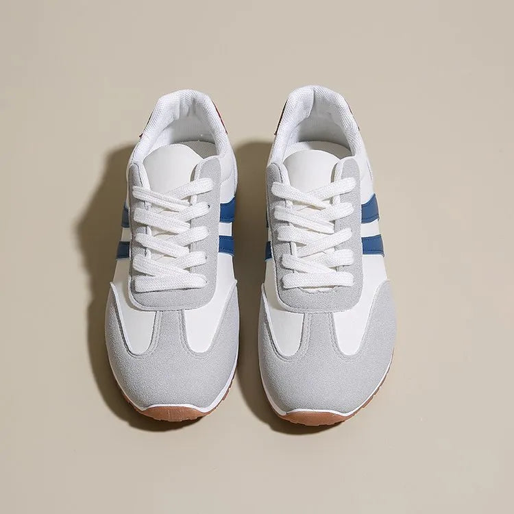 Blue and grey leisure sports shoes with Cortez stripes, flat rubber sole, and round toe.