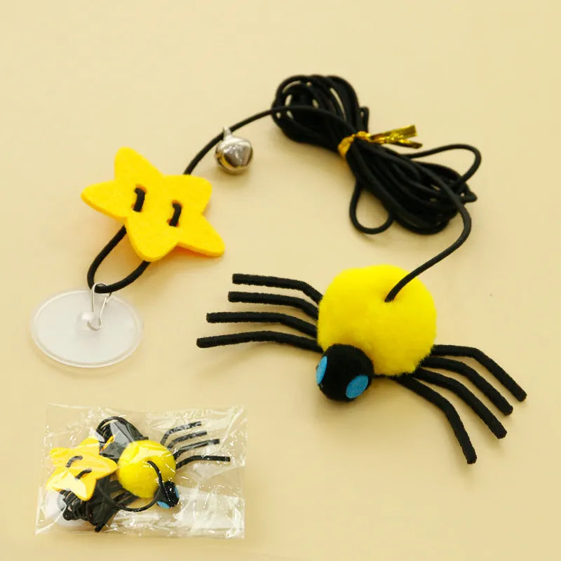 Hanging cat toy with feathers, bell and colourful spiders on elastic rope