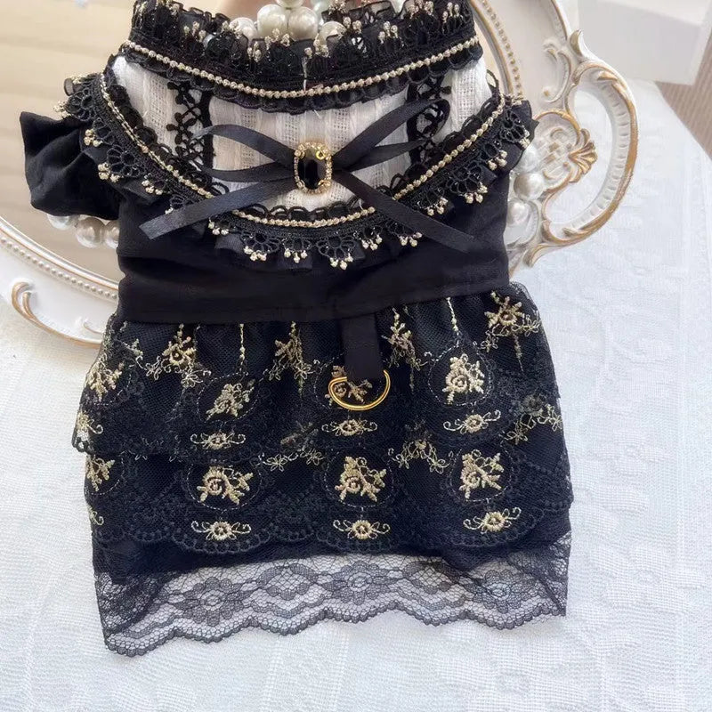 Golden Gothic princess style skirt costume for a small dog or cat on a mannequin.