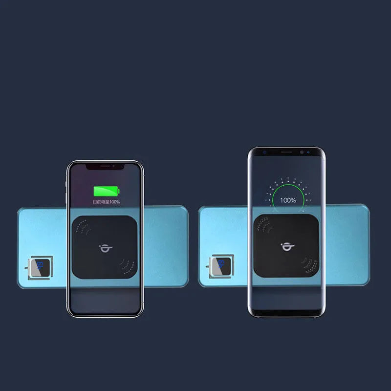 Silver portable power bank with LCD display showing battery percentage, next to a mobile phone.