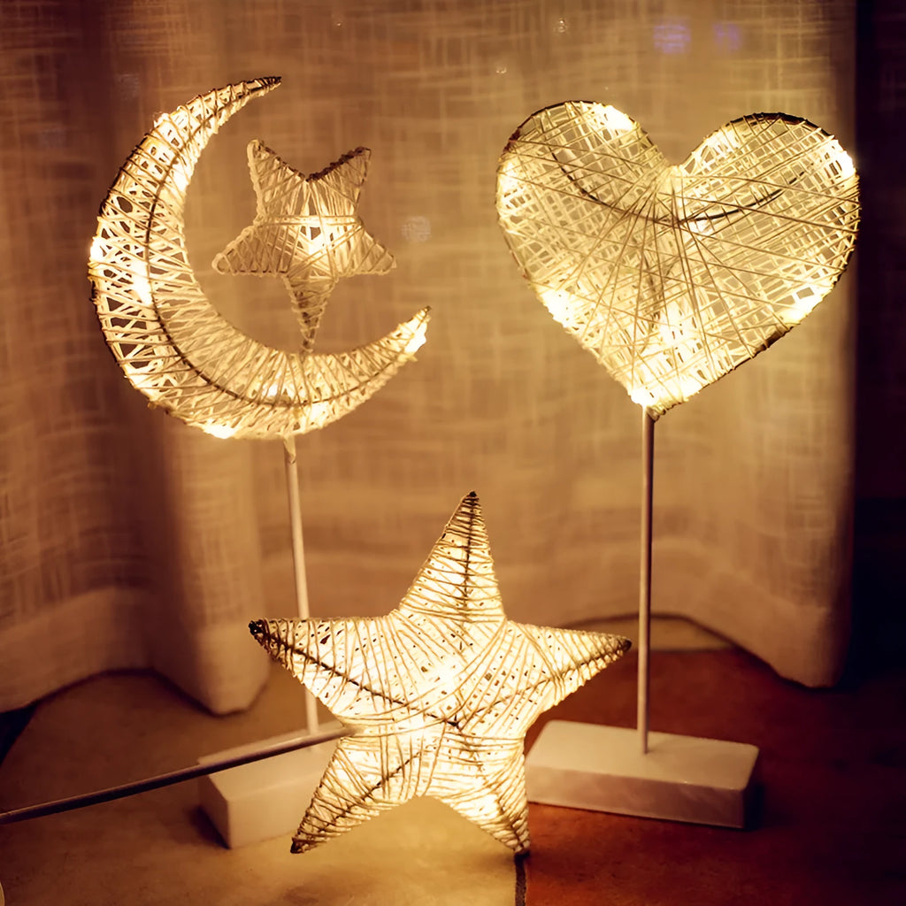 Rattan and PC LED decorative lamp in star, heart, or moon shape on a table.