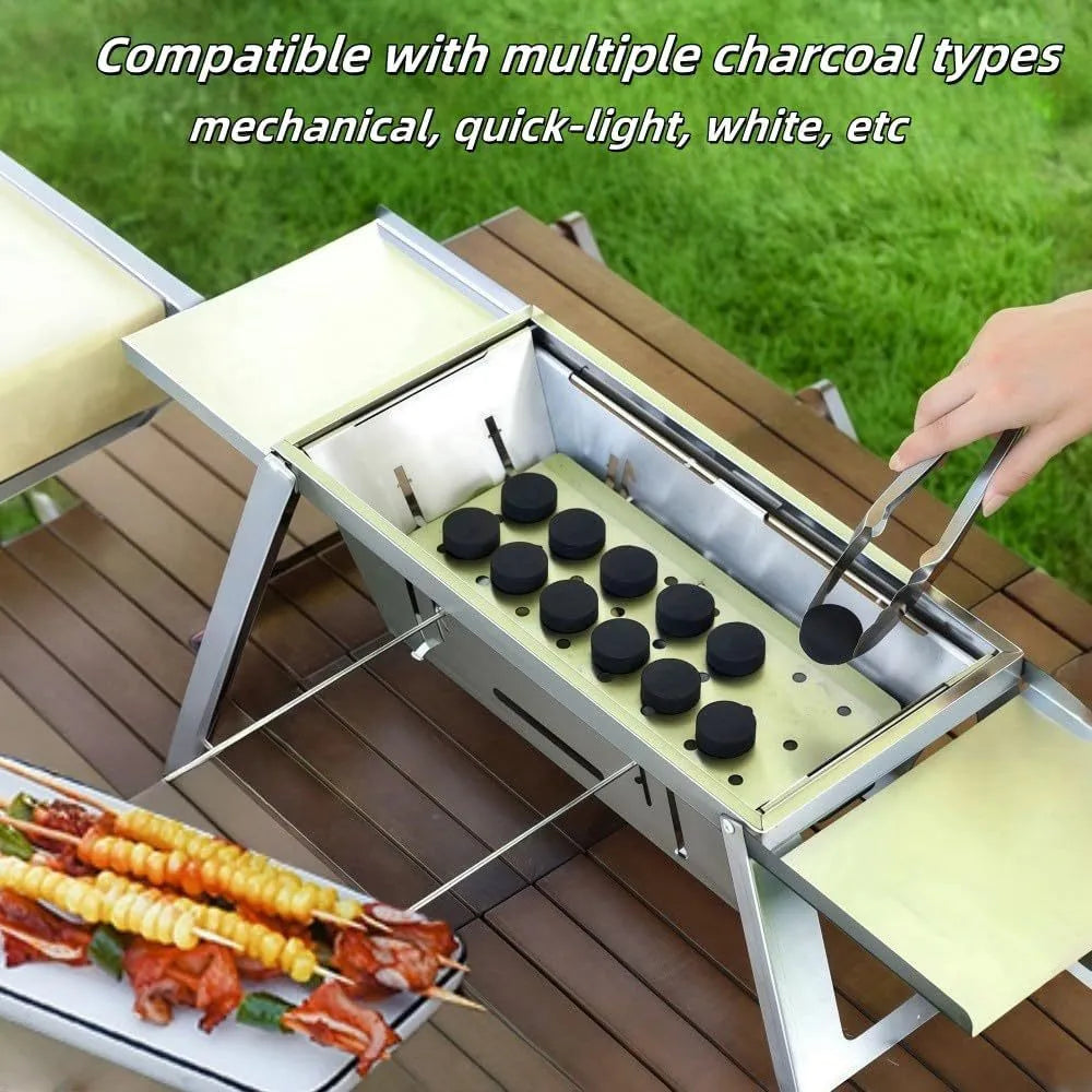 Small portable folding metal charcoal grill for outdoor barbecues.