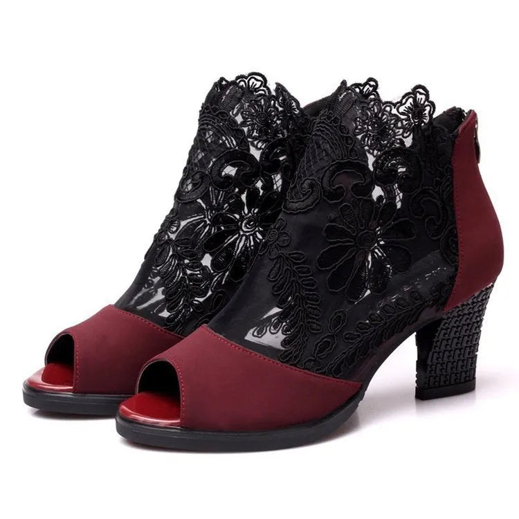 Women's black gladiator sandals with flower lace detailing, square heels, and zip closure