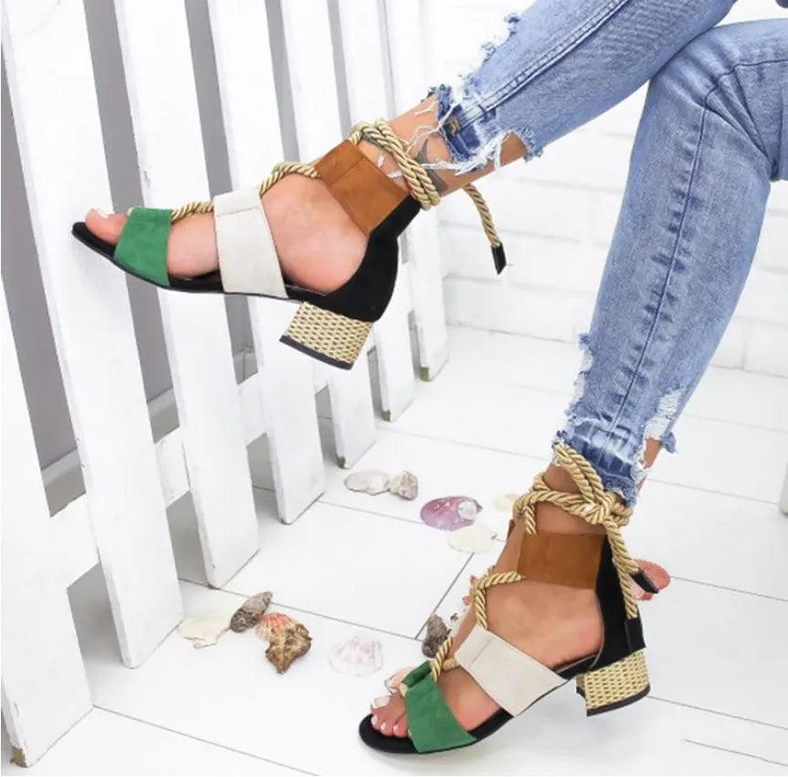 Women's beige suede sandals with thick mid-heel, front strap, and fish-mouth toe.