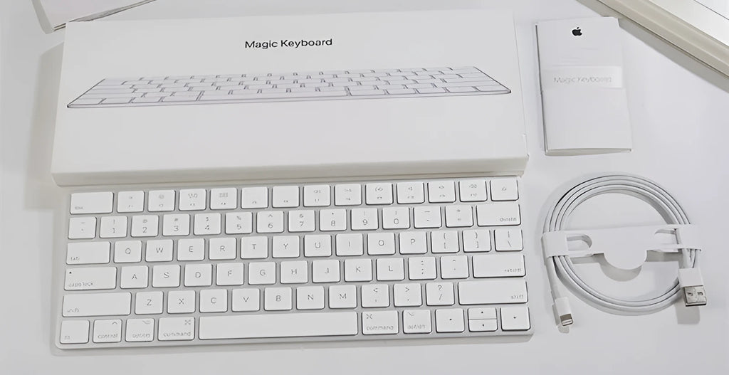 White Apple G6 ultra-thin metal Bluetooth wireless keyboard on a desk.