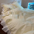 Mori style washed cotton four-piece bedding set in a solid colour, shown with quilt cover, sheet, and pillowcases.