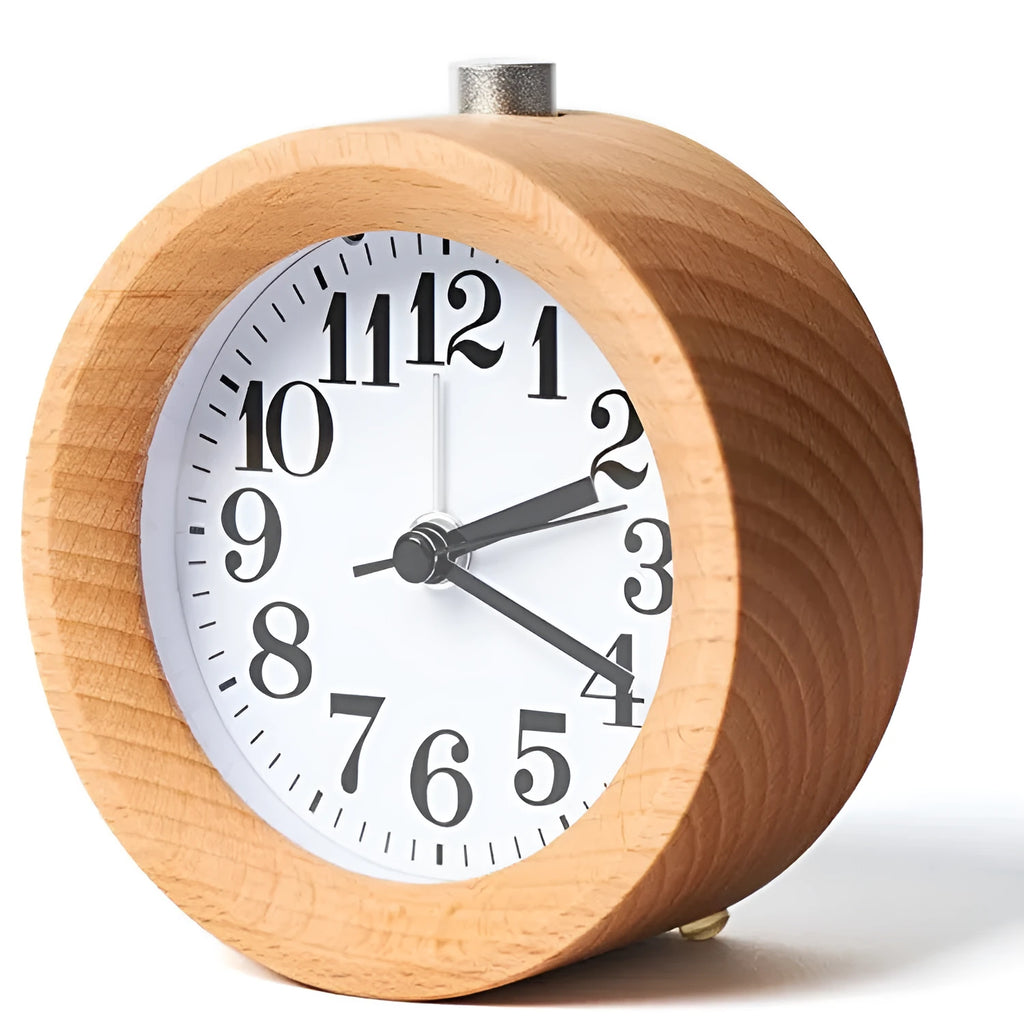 Solid beech wood square alarm clock with traditional analogue dial on wooden surface
