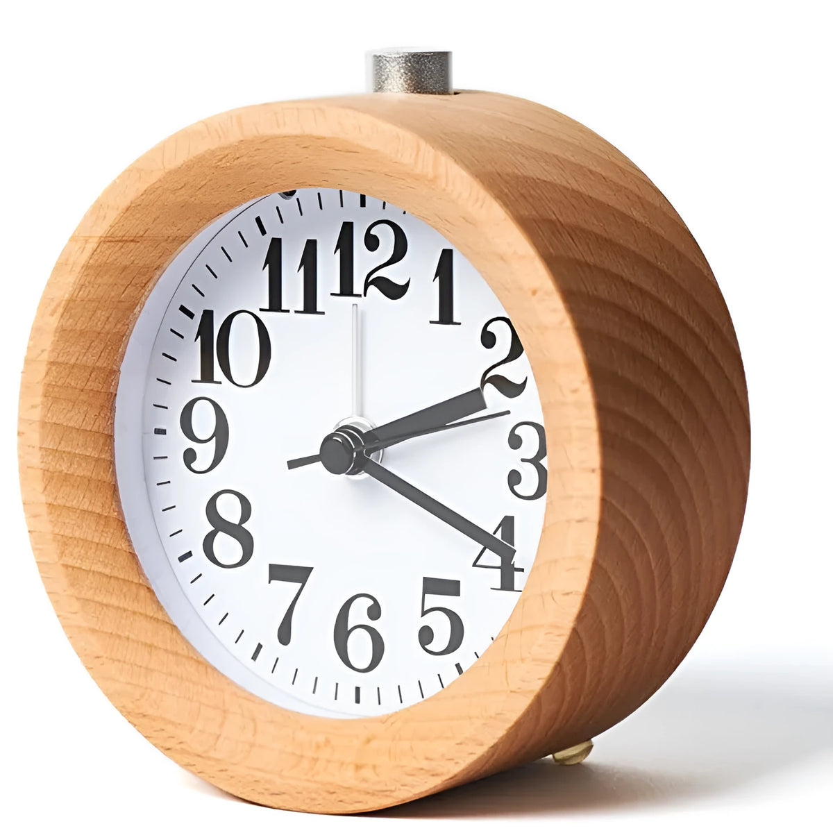 Solid beech wood square alarm clock with traditional analogue dial on wooden surface