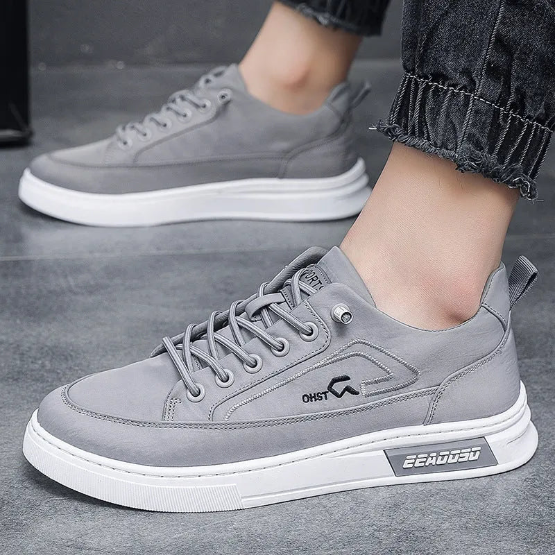 Grey men's canvas sneakers with round toe and lace-up design