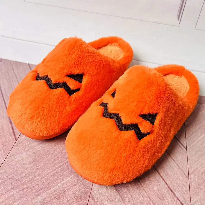 Orange Halloween pumpkin design plush slippers with coral velvet upper and non-slip sole.