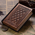 Bronze embossed faux leather A5 notepad with 192 thick unlined pages, lying open.