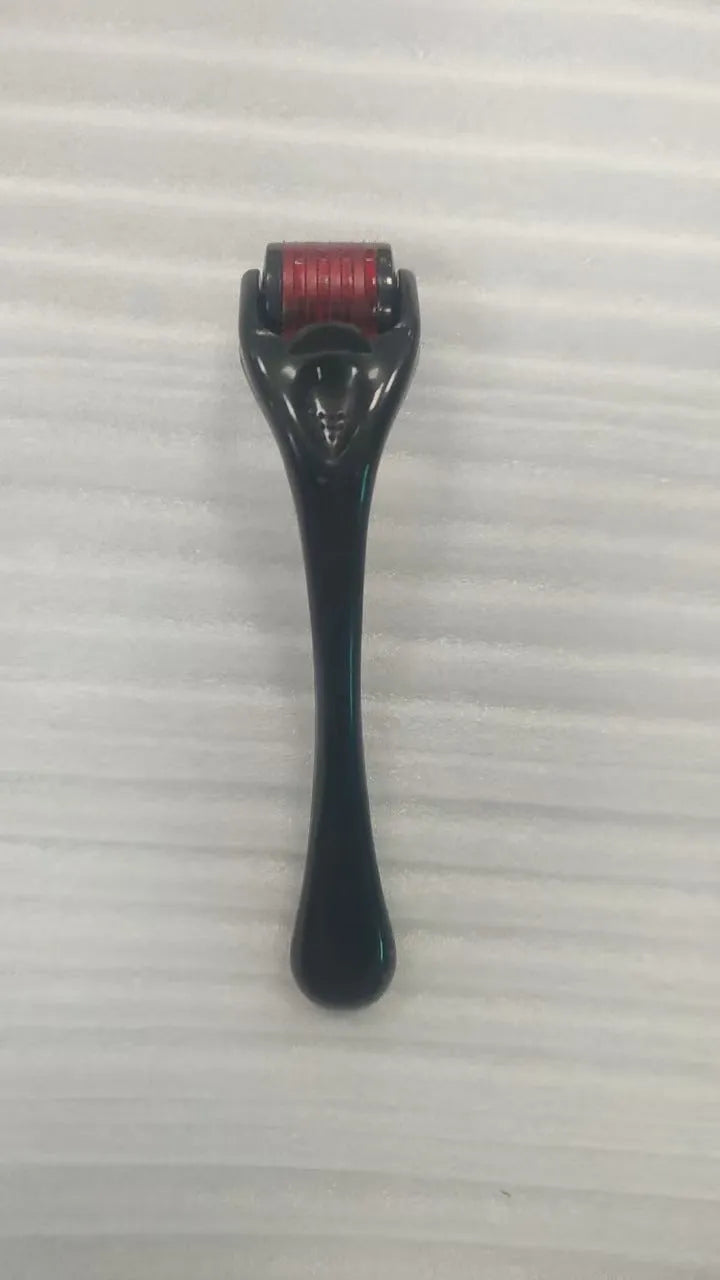 Sterile 540 micro needle derma roller showing handle and needle wheel in assorted colours.