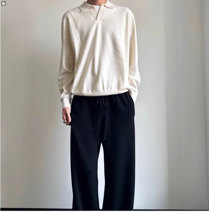 Man wearing a milky white pure wool lapel collar polo sweater with loose fit