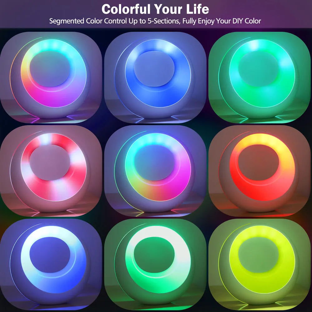 Small white RGB colour changing desk lamp with remote control on a wooden surface.