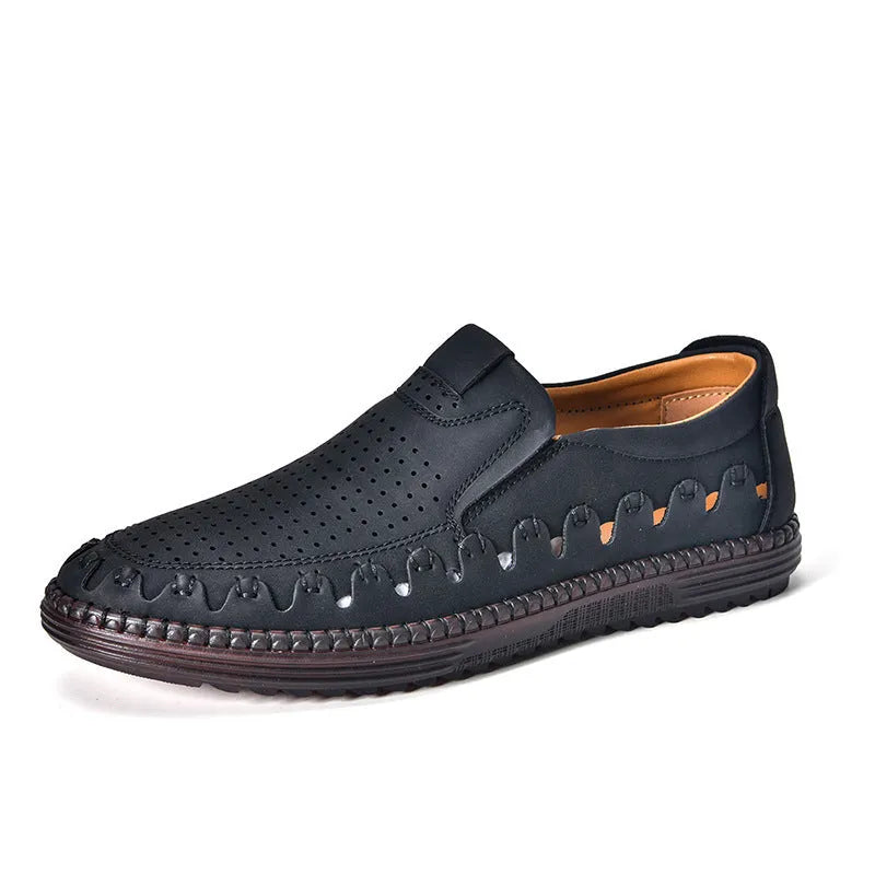 Men's brown leather slip-on casual shoes with flat sole, round toe, and decorative stitching.