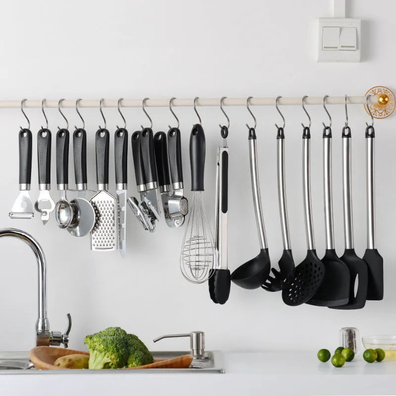 Black silicone and stainless steel kitchen utensil set with 16 pieces including four utensil types