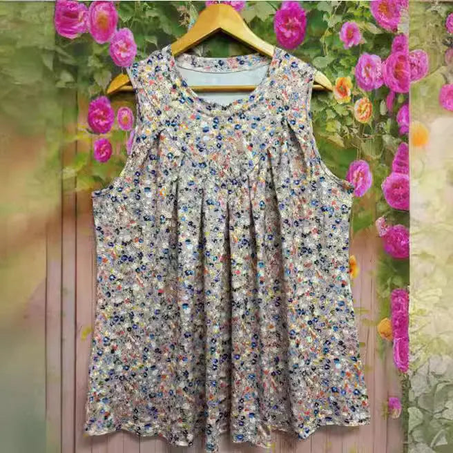 Black floral print plus size sleeveless vest on a hanger, showing round neck and loose fit.