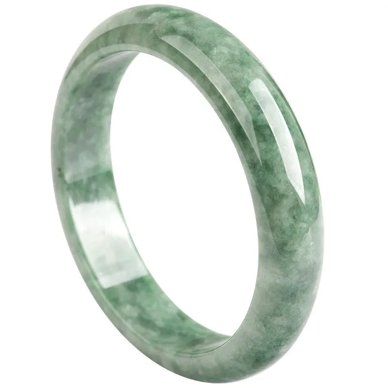 Women's natural emerald bean green ring bracelet on wrist, showing dark pea green beads and gift box.