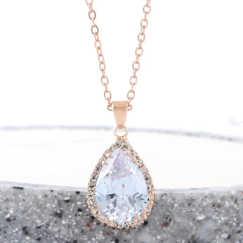 Rose gold water drop necklace with geometric rhinestone pattern in pink colour