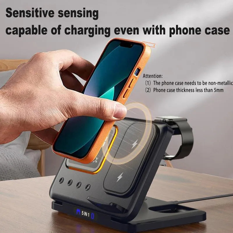 Black or white 5-in-1 wireless charging station with LED display showing time and temperature, charging phone and watch.