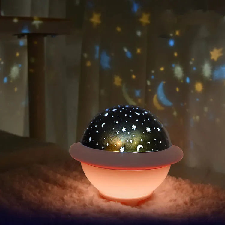UFO-shaped starry sky projection night light in pink white or green plastic with constellation patterns